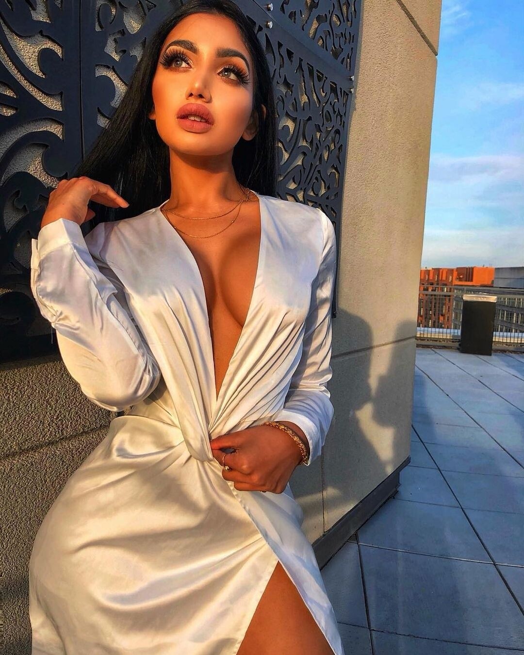 long sleeve white dress with slit front.