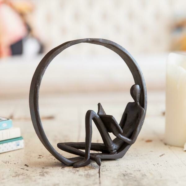 Encircled Reader Cast Iron Sculpture