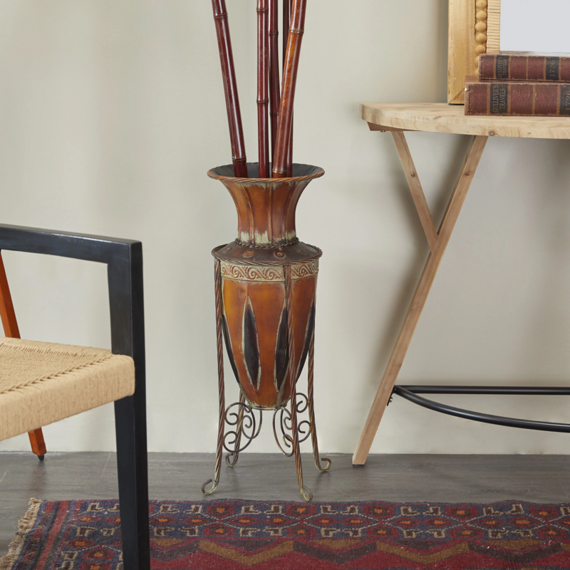 Goods2UQuick 27&quot; Tall Brown Metal Vase with Attached Metal Stand and Intricate Design