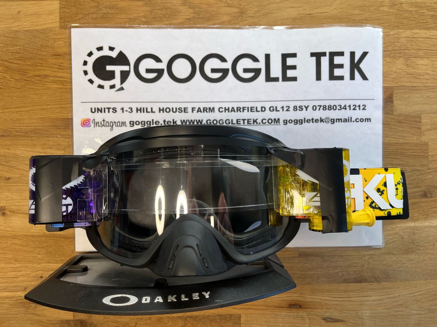 2024 Oakley OFrame 2.0 PRO Black Splatter goggle plus Purple & Yellow Goggletek 36mm roll-off system (clear lens)