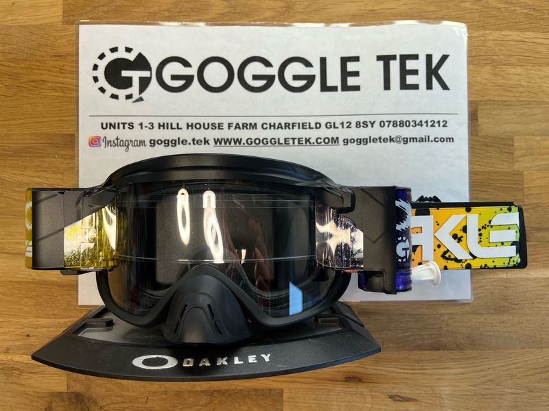 2024 Oakley OFrame 2.0 PRO Black Splatter goggle plus Yellow & Purple Goggletek 36mm roll-off system (clear lens)