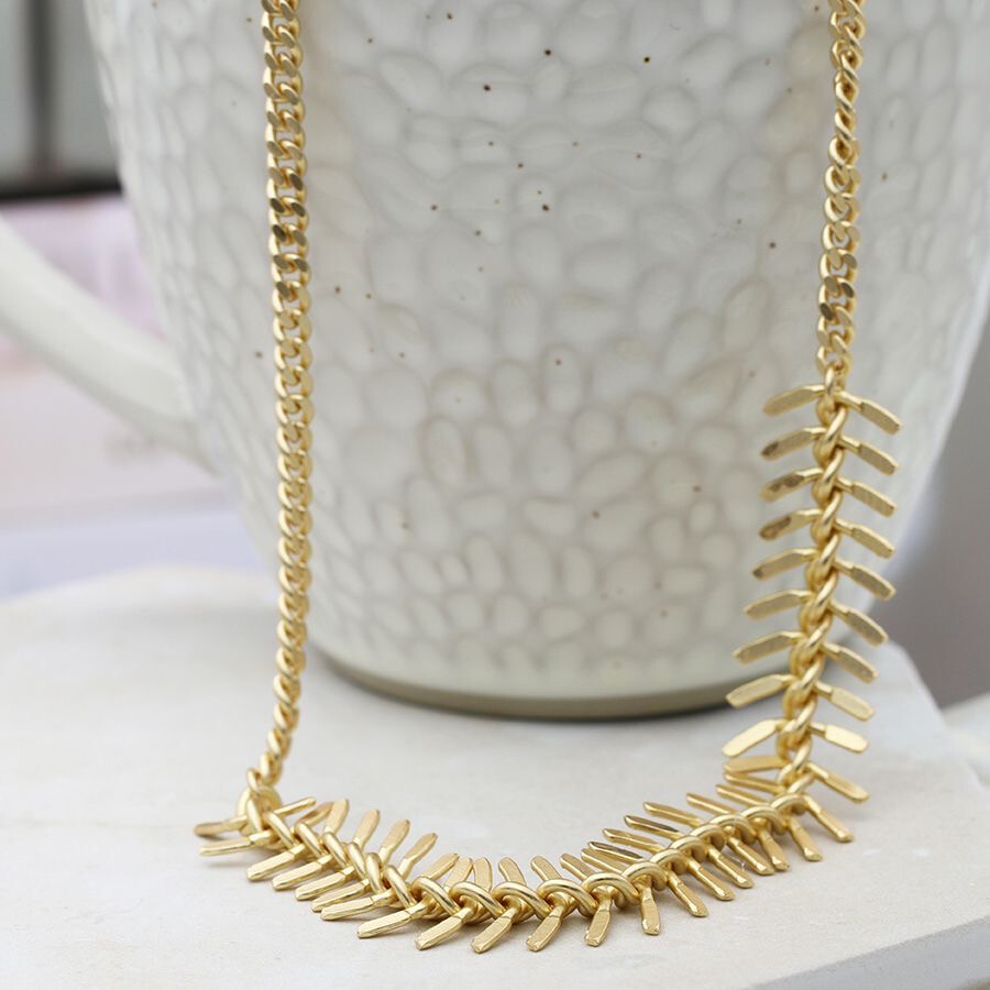 Faux gold plated chain and chevron necklace By POM