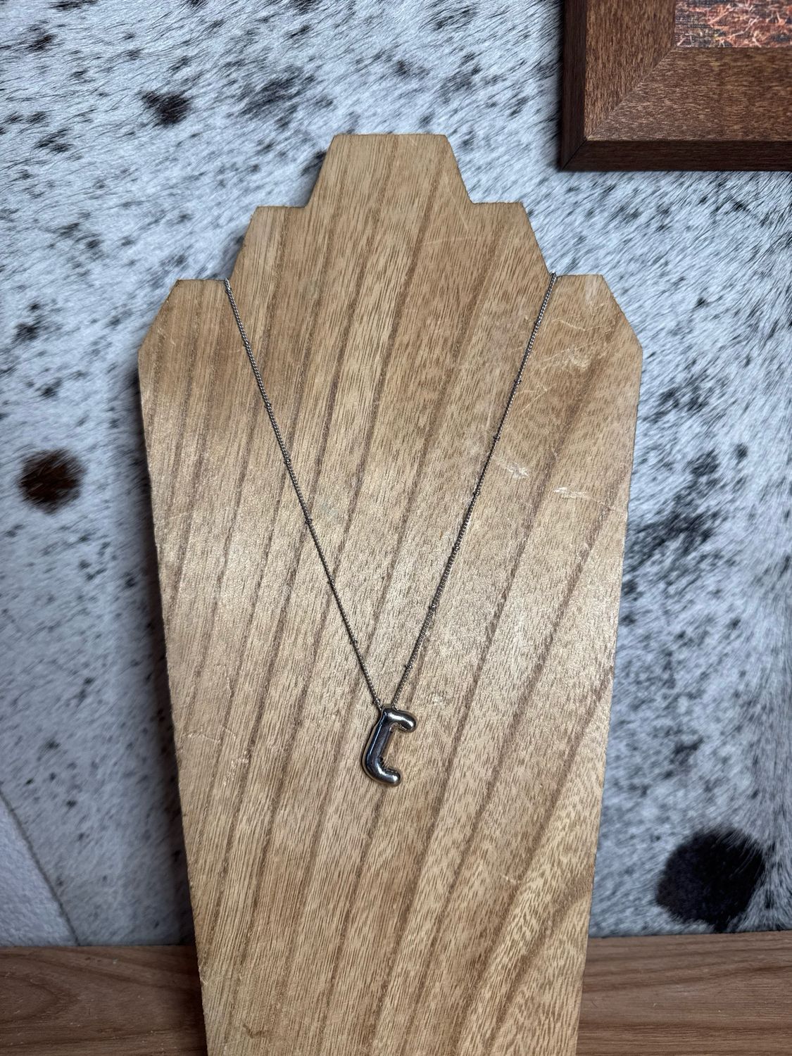 “J” Silver Charm