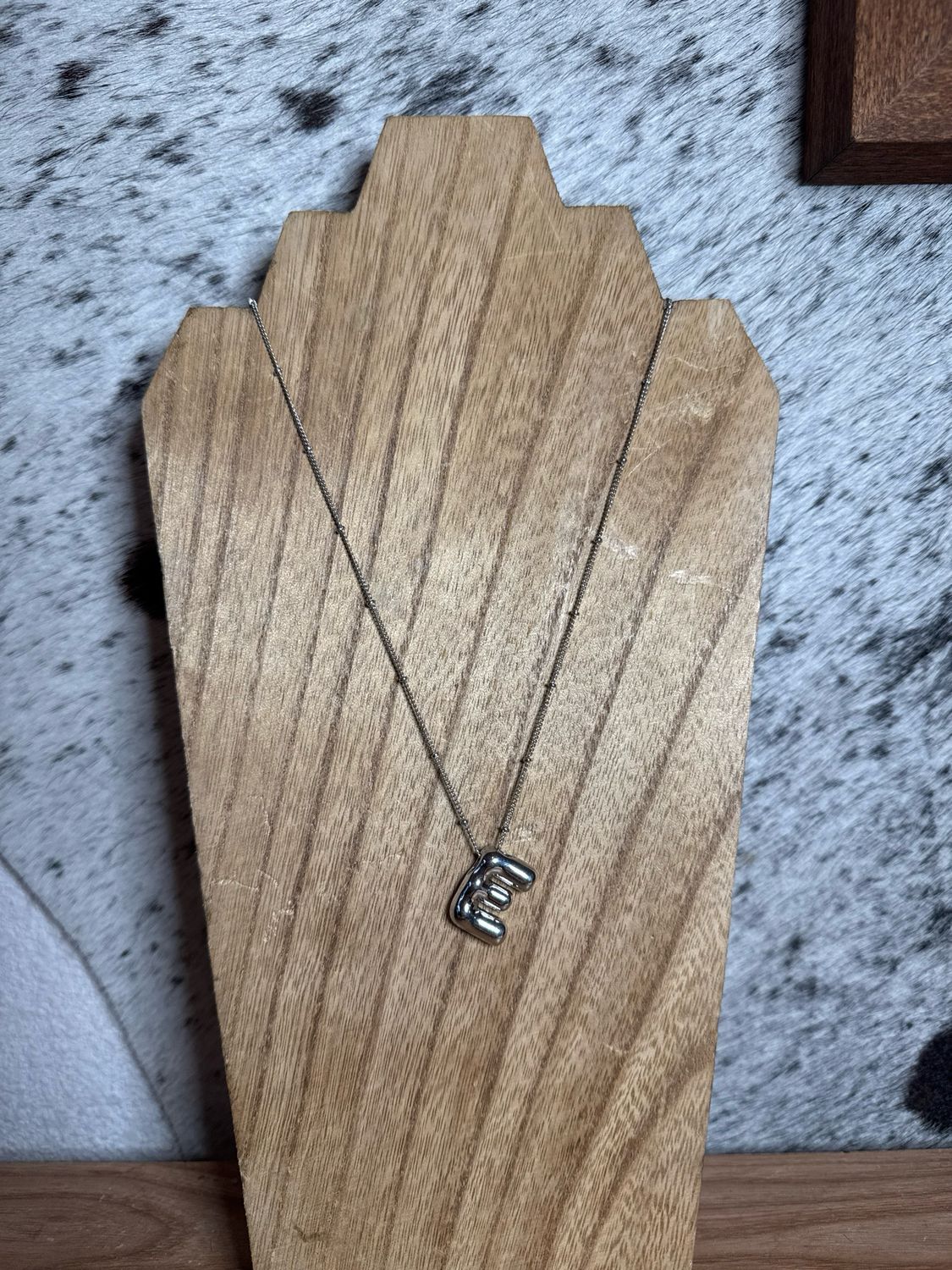 “E” Silver Charm