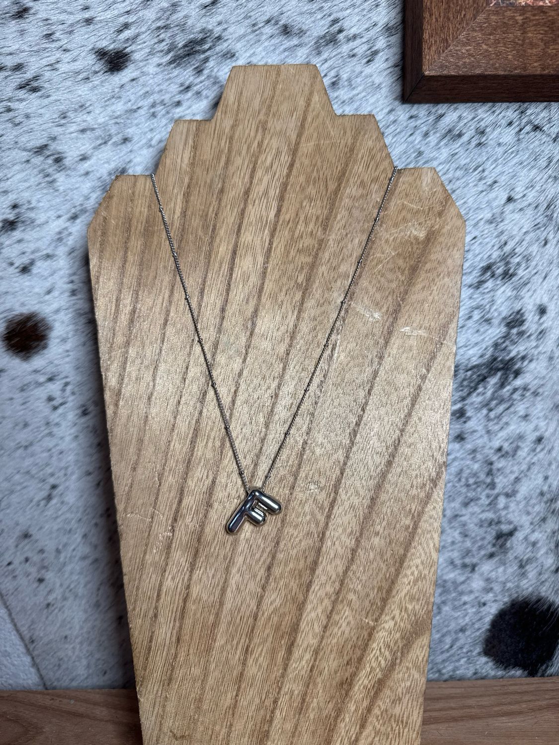 “F” Silver Charm