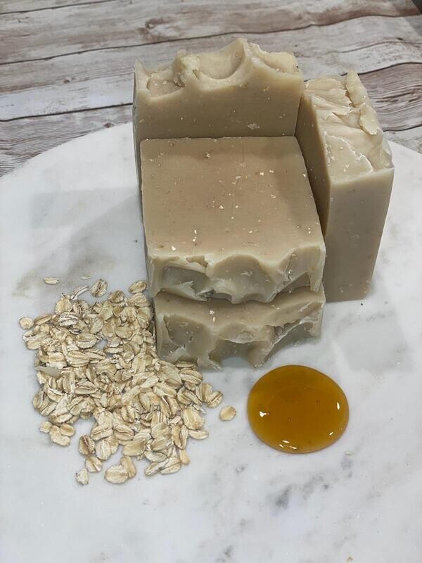 Oatmeal and honey handmade soap bar with oats and honey dipper