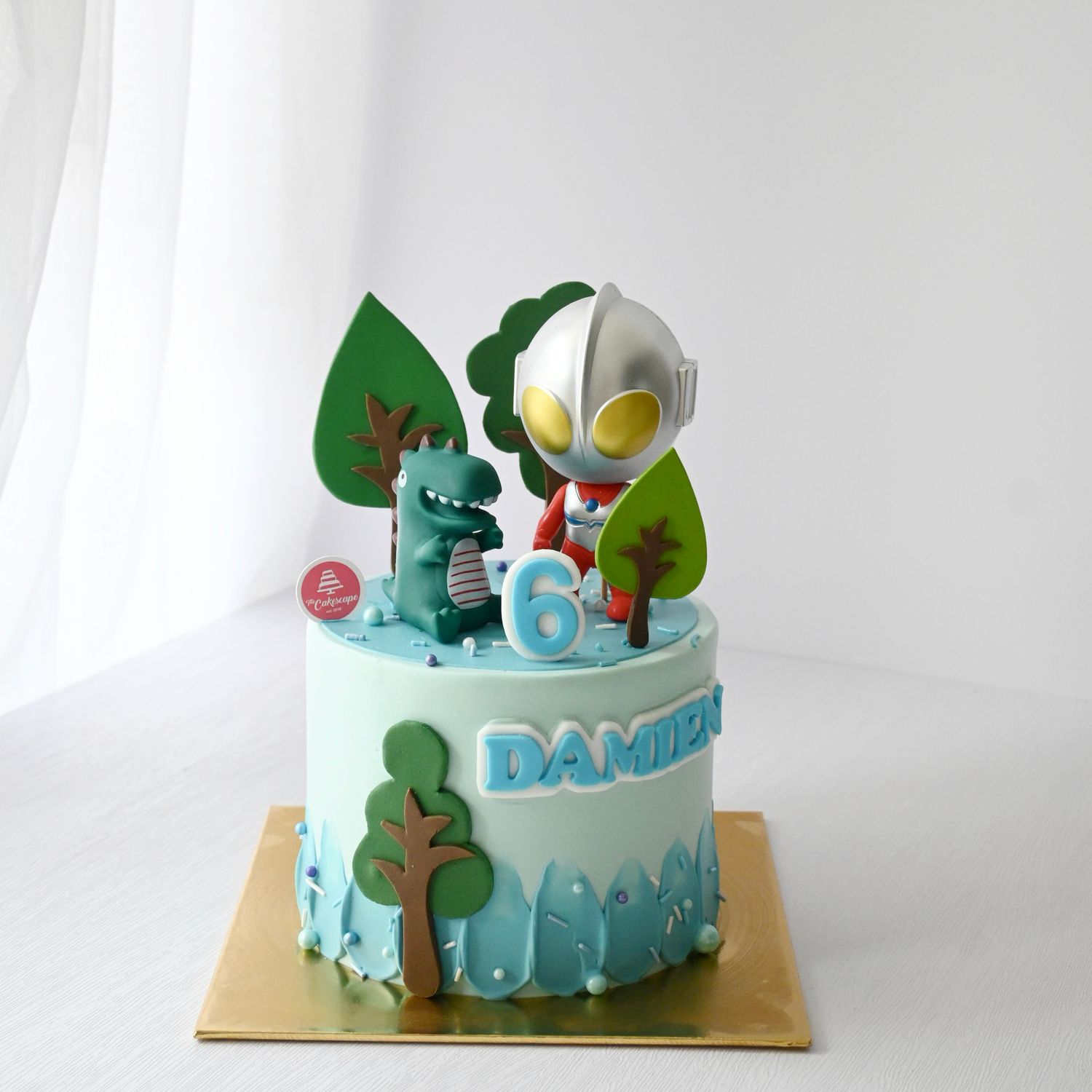 Ultraman &amp; Dinosaur Cake
