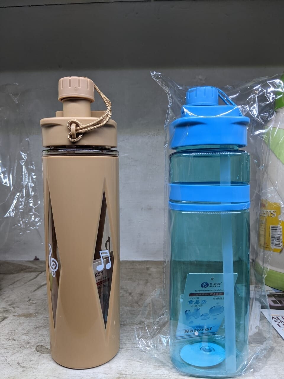 Musical Water bottle with plastic protective cover 750ml .