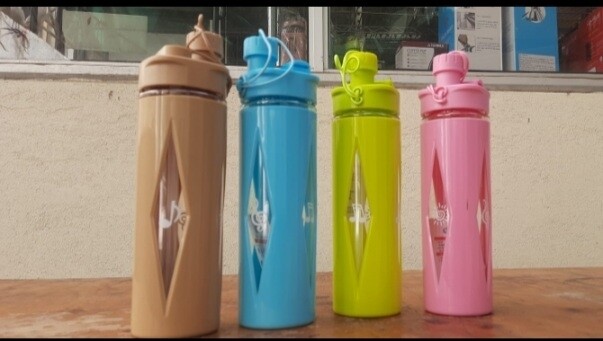 750ml Water bottle with plastic protective cover. brown