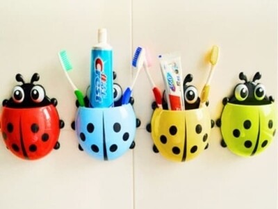 Multipurpose toothbrush holder ladybird
