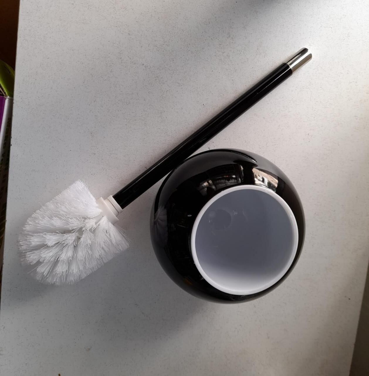 Elegant black toilet brush holder with white removable bowl