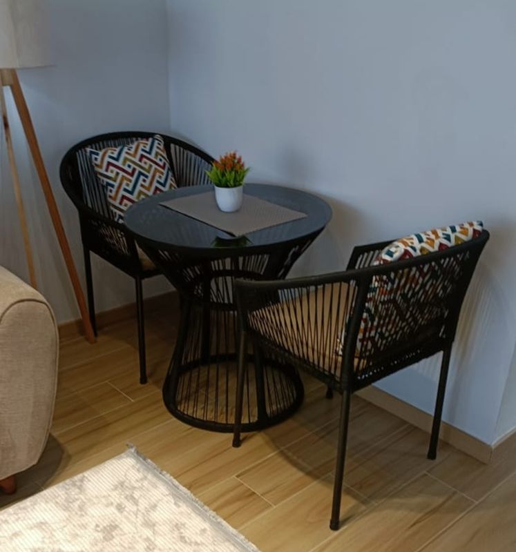 Woven Bistro Set with Glass Tabletop and Patterned Cushions - Perfect for Small Spaces