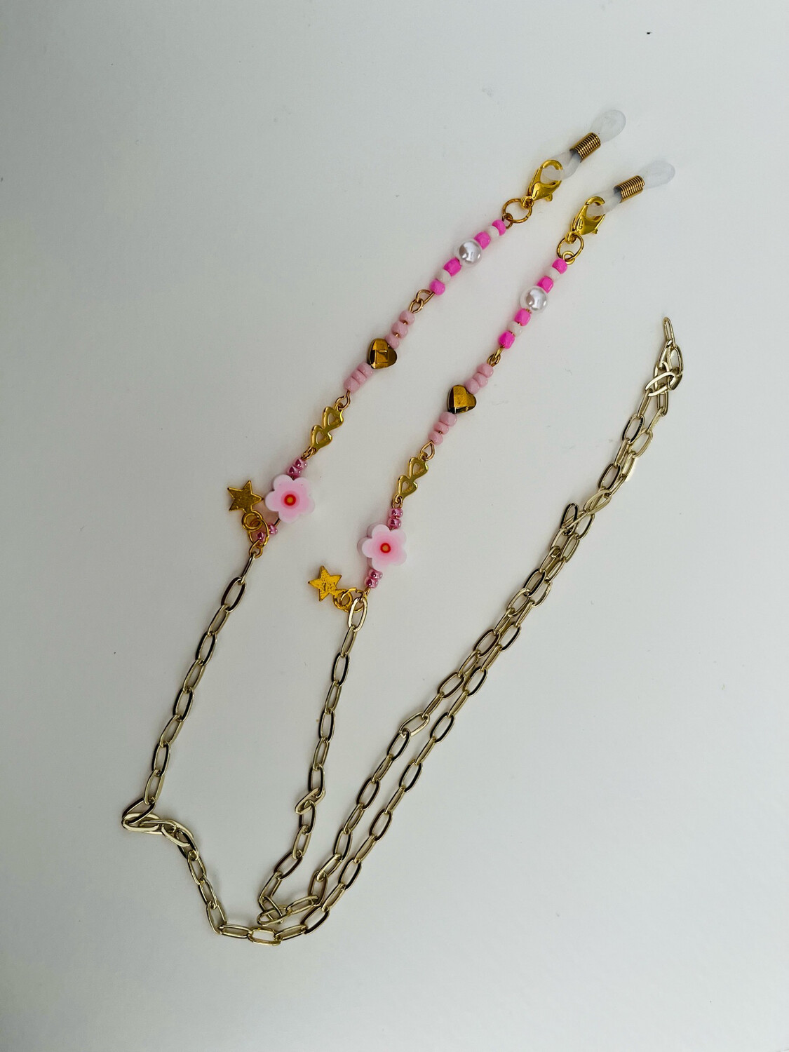 Zonnebrilkoordje Goud / Roze ?