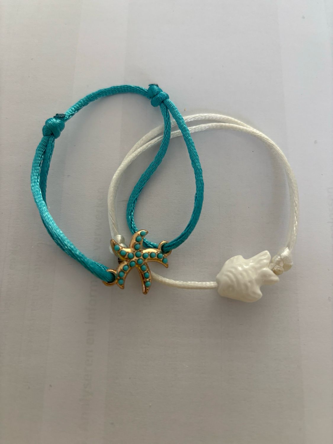 Satijnarmbandje zeester blue