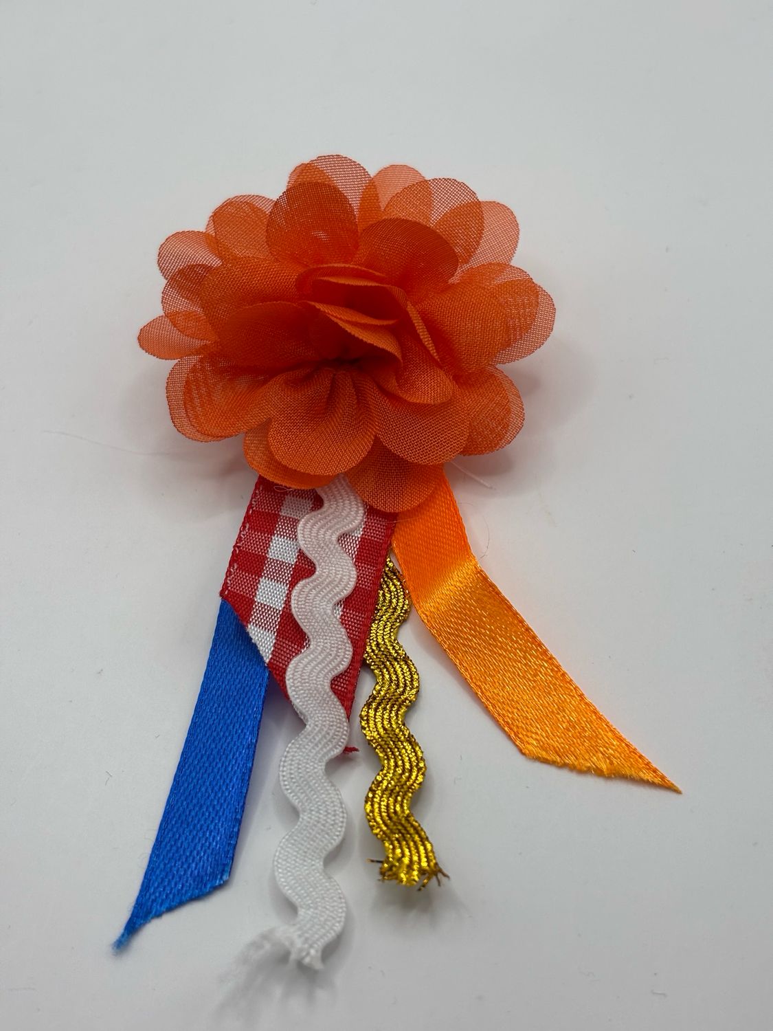 Broche oranje