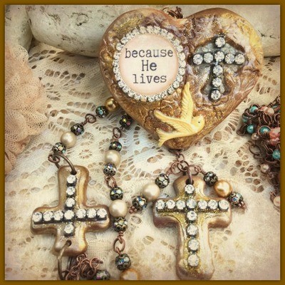 "Because He Lives" - Clay and metal mixed media heart with rhinestone cross, rhinestone wrapped cabochon and dove.