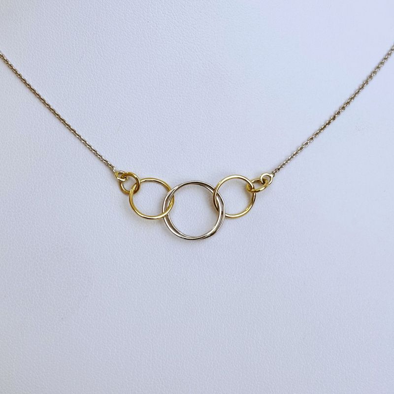 Collier or bicolore six anneaux entrelacés