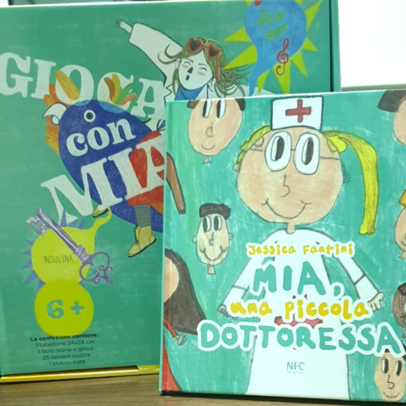 Libro “Mia, una piccola dottoressa” + gioco “Gioca con Mia”