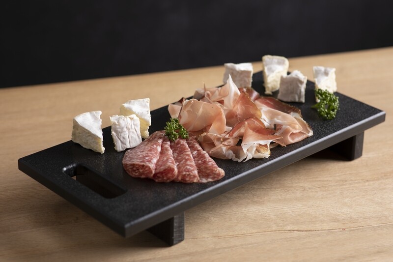 Black polyethylene chopping board with handle and feet