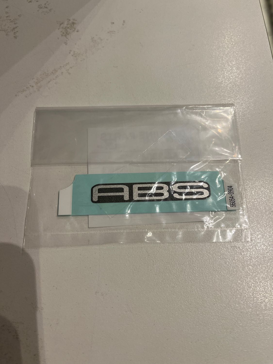 MARK,FR FENDER,ABS/ STICKER ABS PARAFANGO FRONTALE