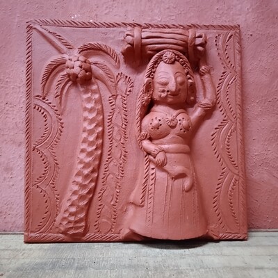 Terracotta Lady carrying grass