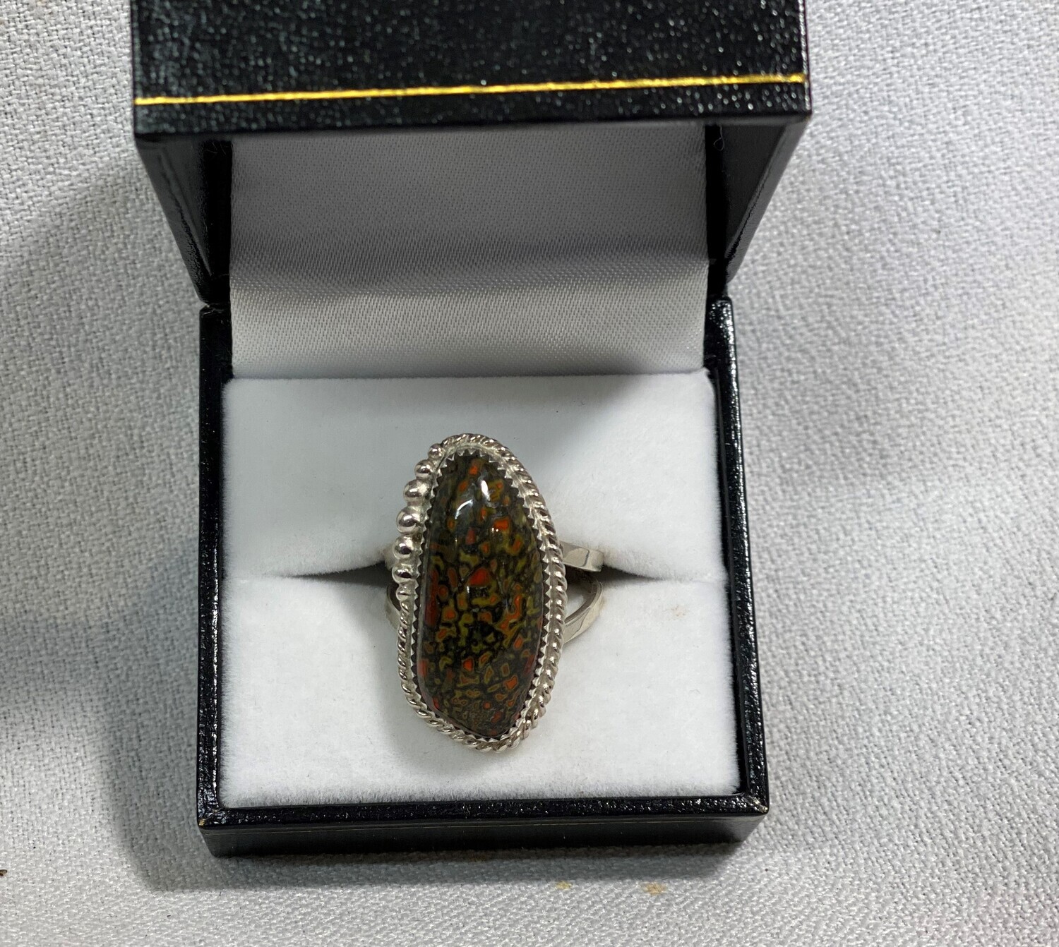 SOLD. Rare combination of Green and red gem dino bone
