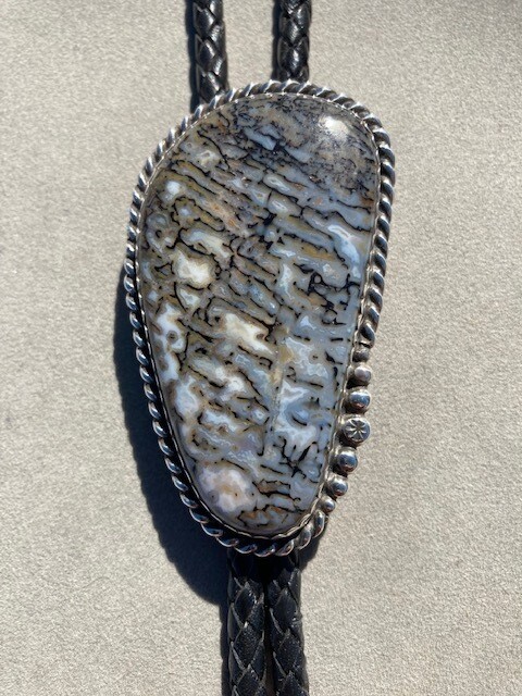 Striking Gray and tan gem bone bola