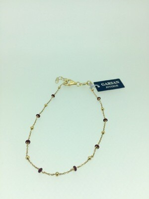 Pulsera de plata bañada en oro amarillo con piedras rojas