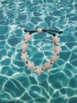 Bracciale tartarughe in ceramica colore bianco. Bracciale tartarughe in ceramica colore bianco.