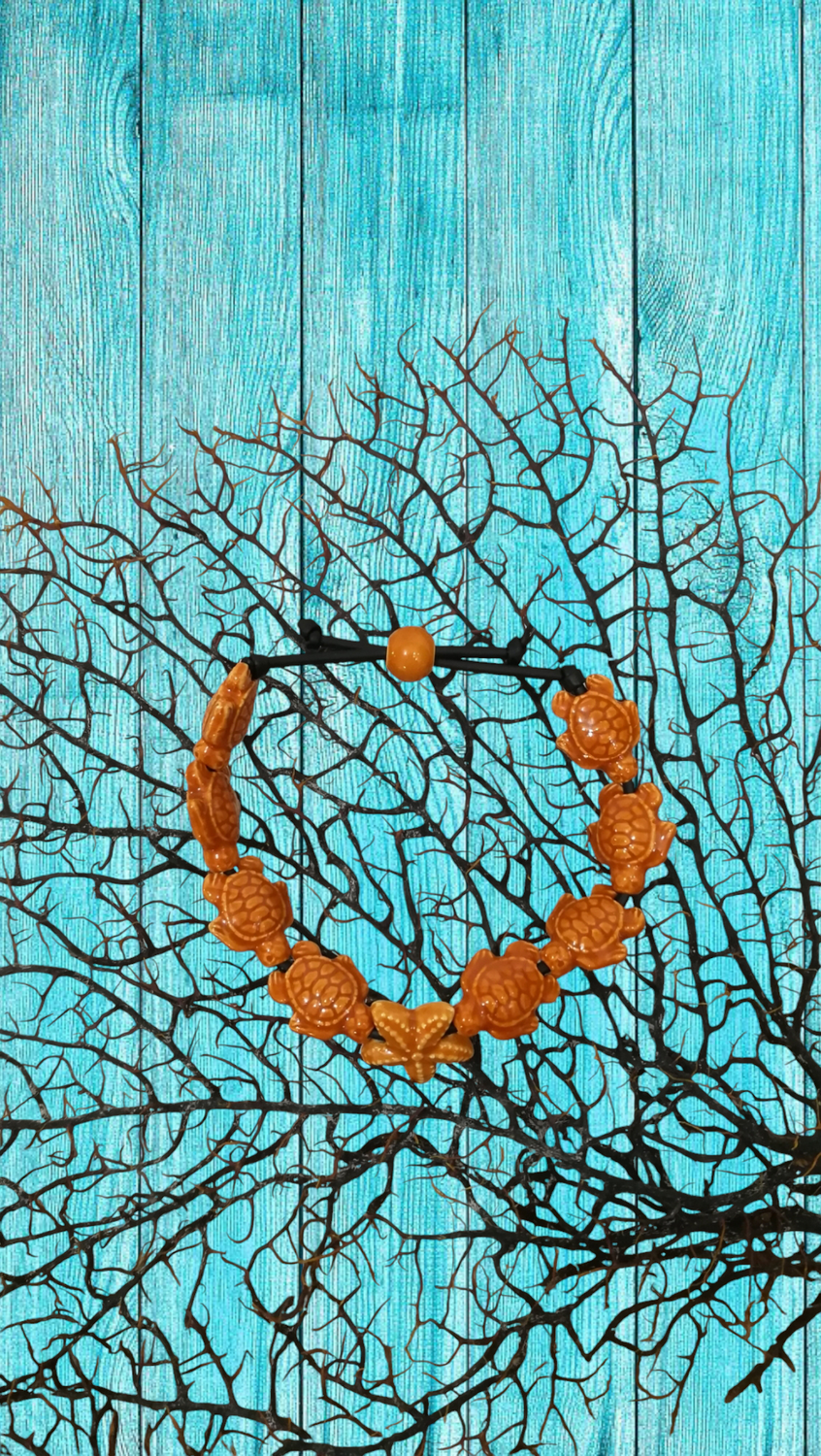 Bracciale tartarughe in ceramica colore miele.