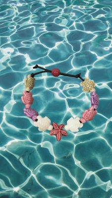 Bracciale tartarughe in ceramica colore beige,lilla,rosa chiaro,bianco. stella rosa scuro