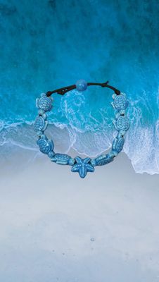 Bracciale tartarughe in ceramica colore turchese.