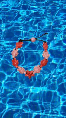 Bracciale tartarughe in ceramica colore rosa chiaro e rosa scuro, stella rosa scuro.