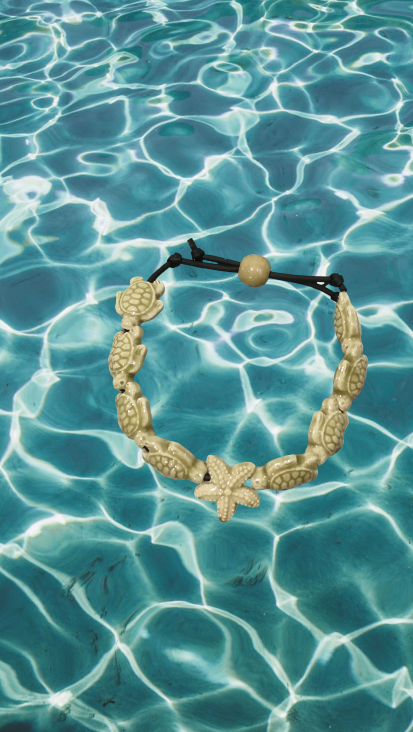 Bracciale tartarughe in ceramica colore beige.