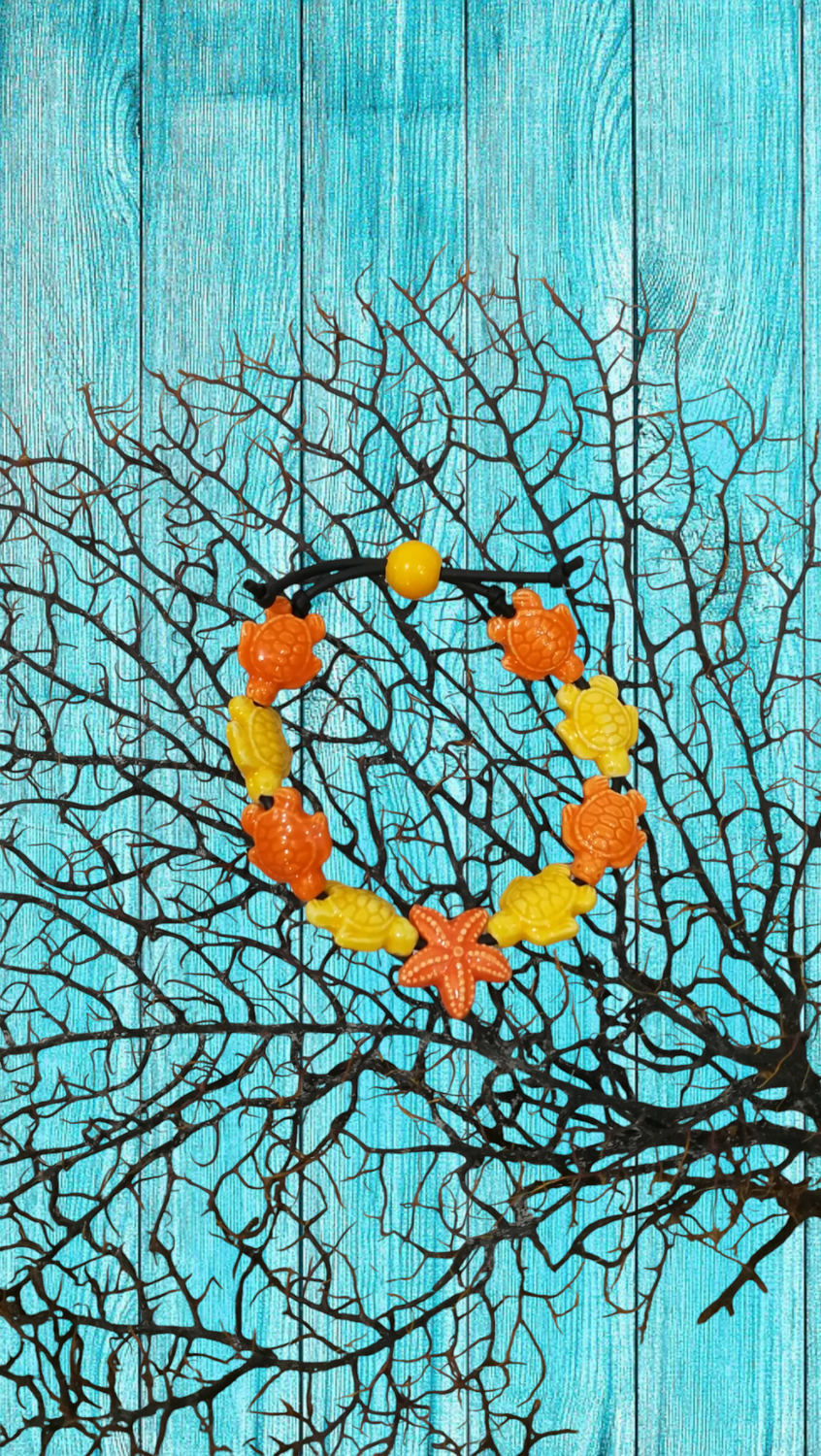 Bracciale tartarughe in ceramica colore giallo limone e arancione stella arancione.