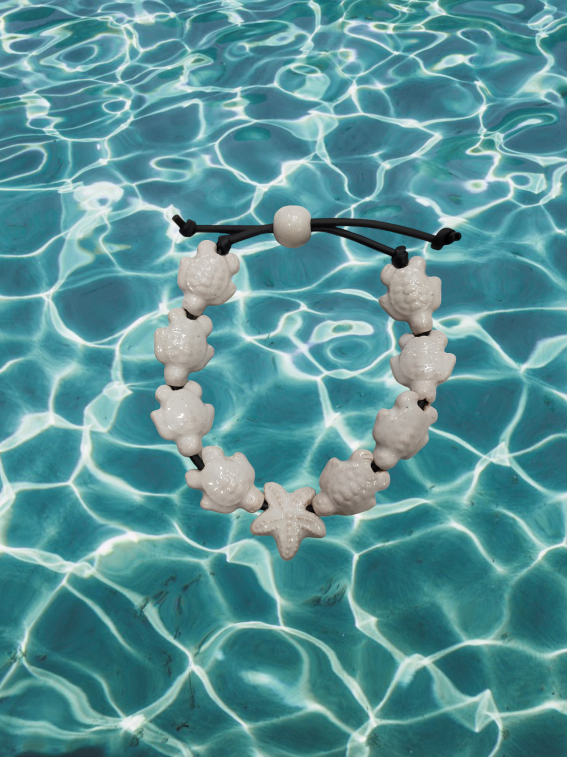 Bracciale tartarughe in ceramica colore bianco.