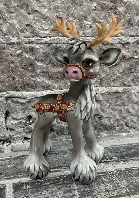 Grey Reindeer with harness for sled