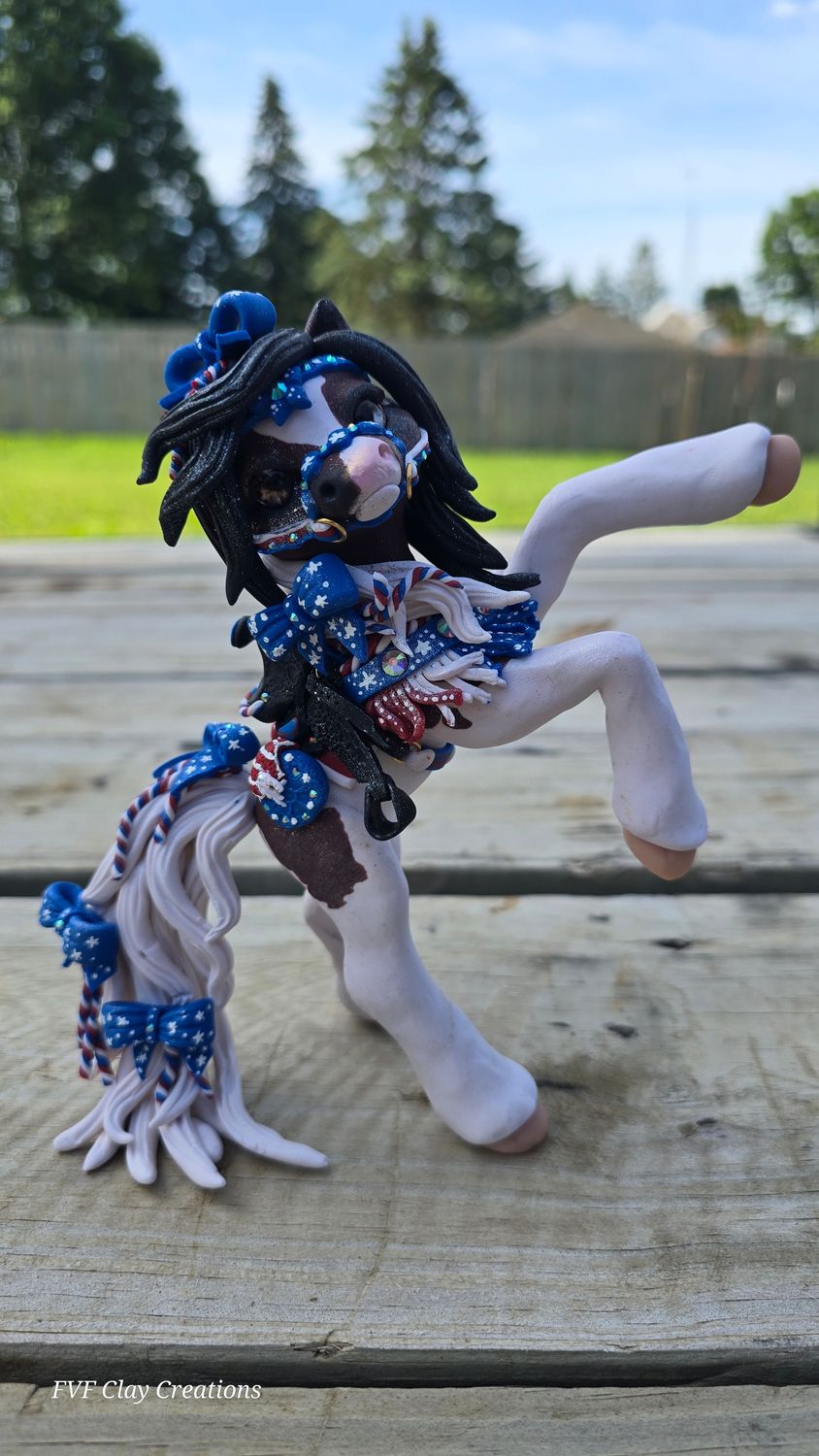 Red white and blue rearing tack pony