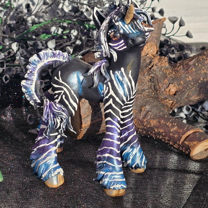 Black/purple/blue unicorn