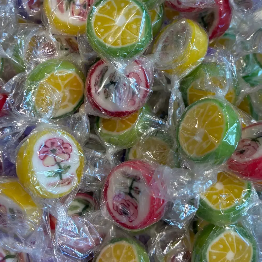 Temmerman rock candies, round hard boiled fruit sweets with a flower motif inside the mass