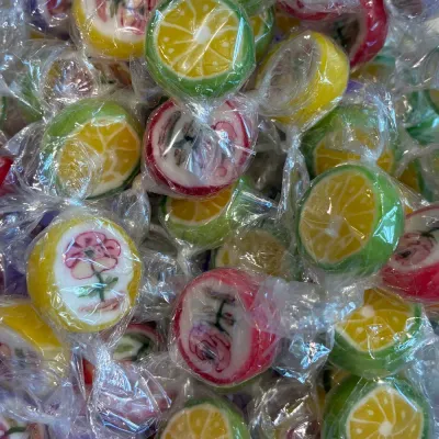 Temmerman rock candies, round hard boiled fruit sweets with a flower motif inside the mass