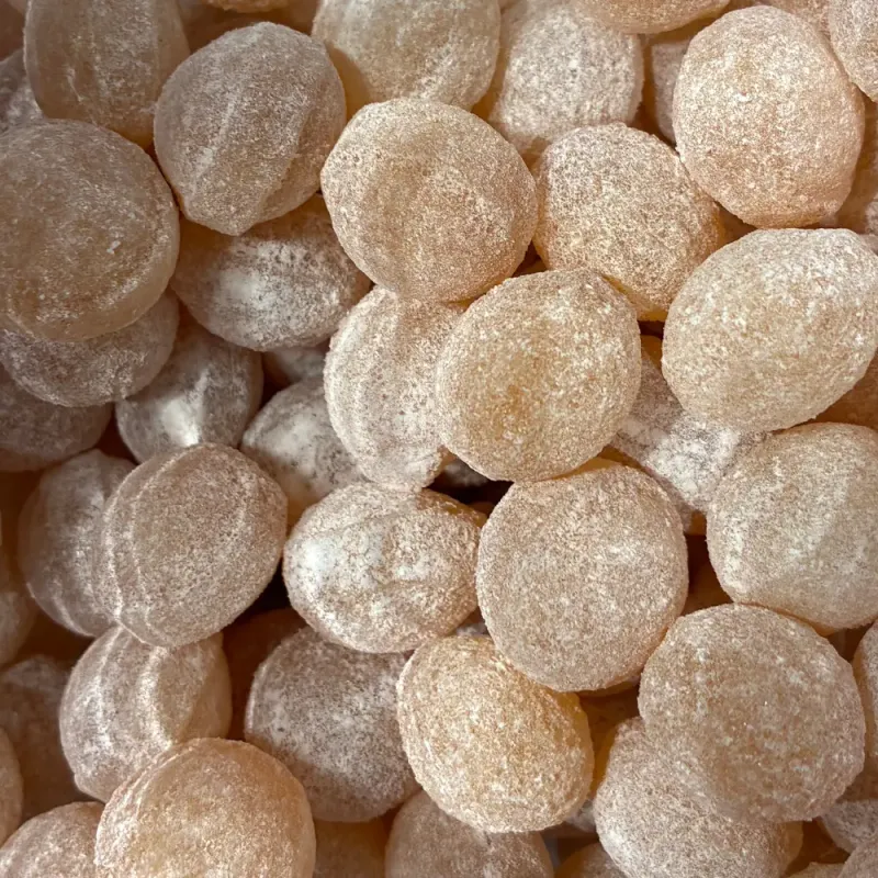 Temmerman honey drops, golden hard boiled sugar sweets with honey flavour, in a ball shape