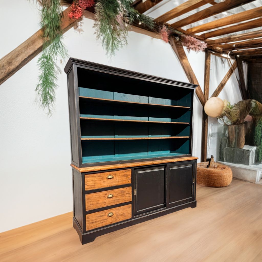 This teak sideboard is a real eye-catcher in any interior. With its stylish combination of old wood, matt black frame and petrol blue back wall, this cabinet fits perfectly in a rural, industrial or bohemian living style.