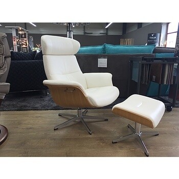 Fauteuil relaxant blanc et son repose pied