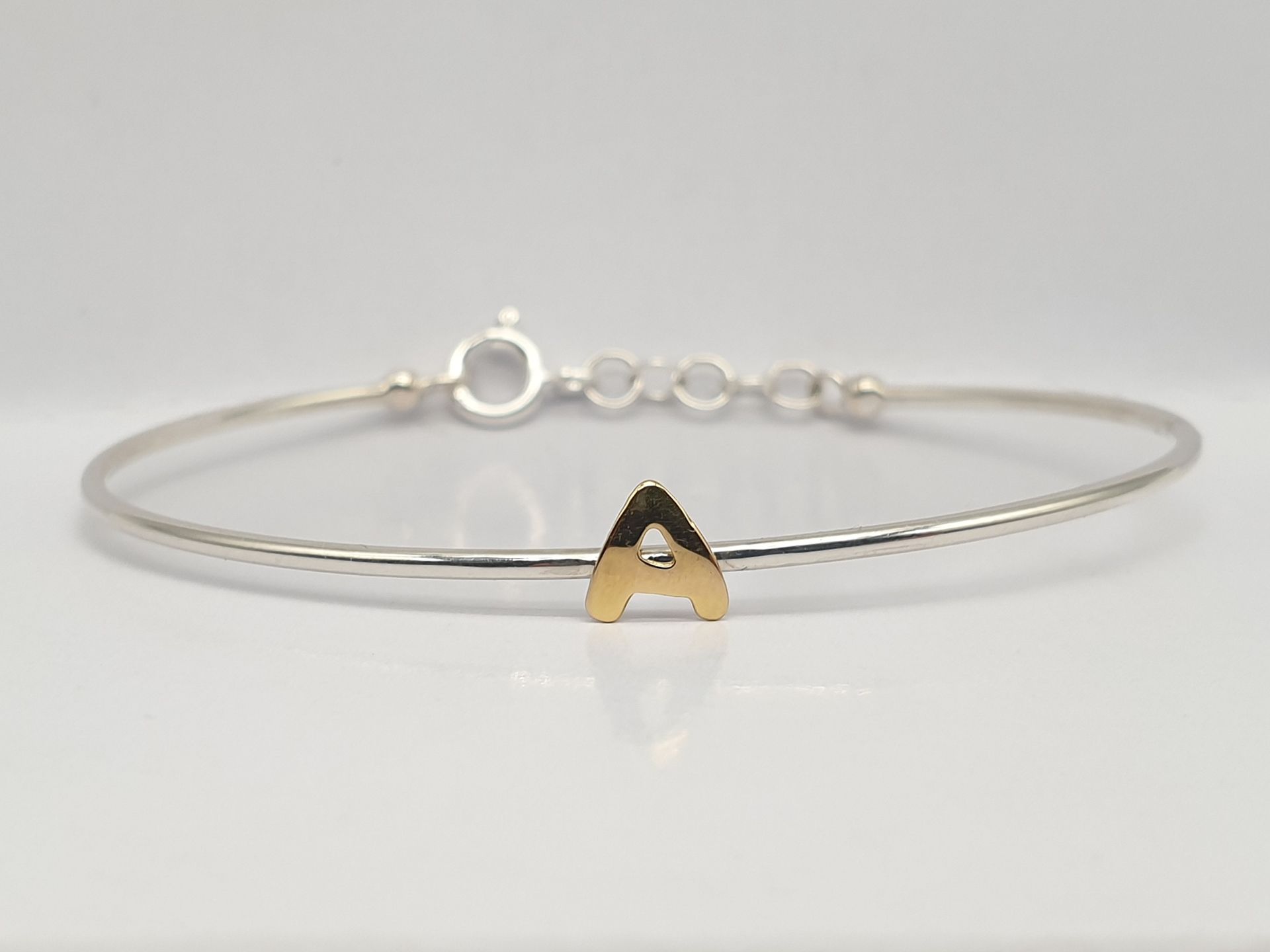 Bracciale rigido in Argento e  lettera in Oro