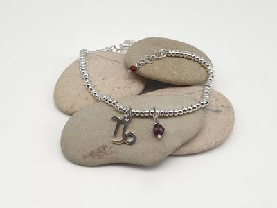 CAPRICORNO-granato, Bracciale con simbolo e gemma