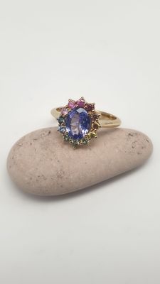 Anello in oro giallo 18ct con Tanzanite naturale ct 1.07 e controno di zaffiri multicolore ct 0.42 Anello in oro giallo 18ct con Tanzanite naturale ct 1.07 e controno di zaffiri multicolore ct 0.42