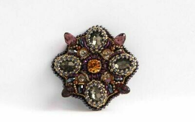 The brooch-medal with crystals "Symmetry"