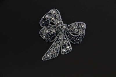 Brooch with crystals "Silver bow"