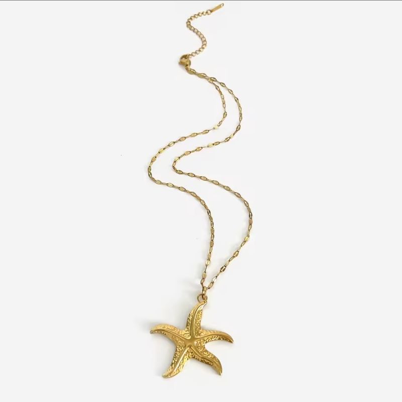 Gold sea star necklace